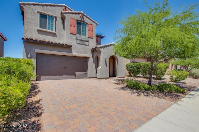 13391 N Flaxleaf Pl, Oro Valley, AZ 85755 - mediterranean / spanish home with a tiled roof, a garage, stucco siding, and driveway