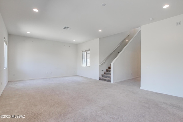 13391 N Flaxleaf Pl, Oro Valley, AZ 85755 - unfurnished room with stairs, recessed lighting, light carpet, and baseboards