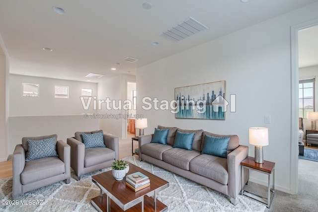 13391 N Flaxleaf Pl, Oro Valley, AZ 85755 - living area featuring recessed lighting, light colored carpet, and baseboards