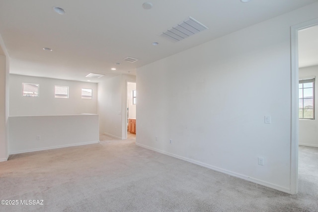 13391 N Flaxleaf Pl, Oro Valley, AZ 85755 - spare room featuring light colored carpet, healthy amount of natural light, baseboards, and recessed lighting
