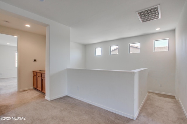 13391 N Flaxleaf Pl, Oro Valley, AZ 85755 - spare room featuring light colored carpet, recessed lighting, and baseboards