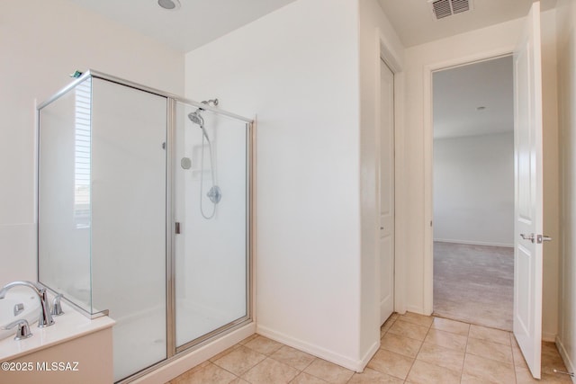 13391 N Flaxleaf Pl, Oro Valley, AZ 85755 - bathroom featuring a stall shower, tile patterned floors, baseboards, and a tub to relax in
