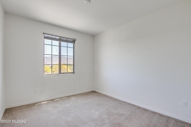 13391 N Flaxleaf Pl, Oro Valley, AZ 85755 - spare room featuring carpet flooring and baseboards