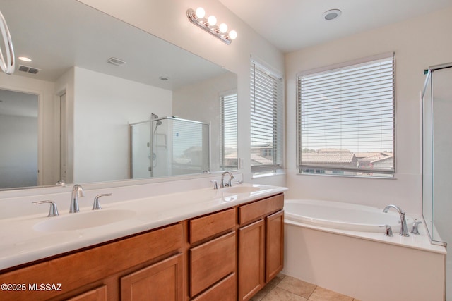 13391 N Flaxleaf Pl, Oro Valley, AZ 85755 - bathroom featuring a shower stall, healthy amount of natural light, a bath, and double vanity