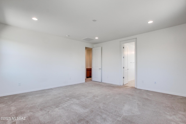 13391 N Flaxleaf Pl, Oro Valley, AZ 85755 - unfurnished room featuring recessed lighting, light carpet, and baseboards