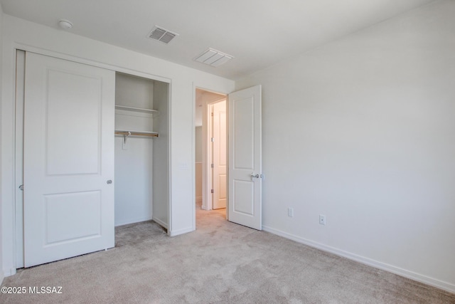 13391 N Flaxleaf Pl, Oro Valley, AZ 85755 - unfurnished bedroom featuring carpet, a closet, and baseboards