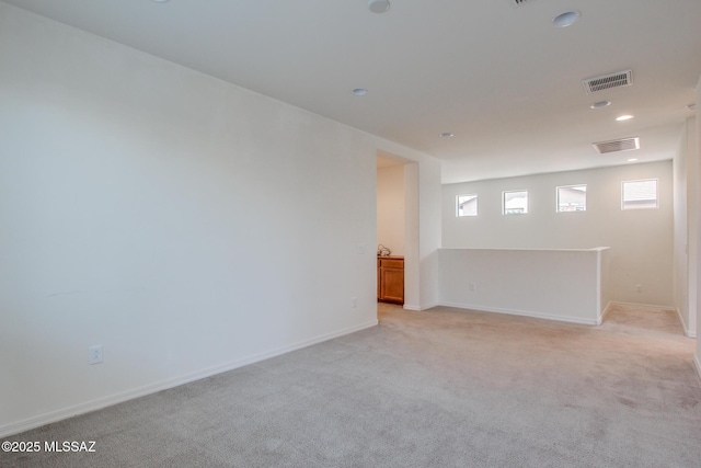 13391 N Flaxleaf Pl, Oro Valley, AZ 85755 - spare room featuring light colored carpet, baseboards, and recessed lighting