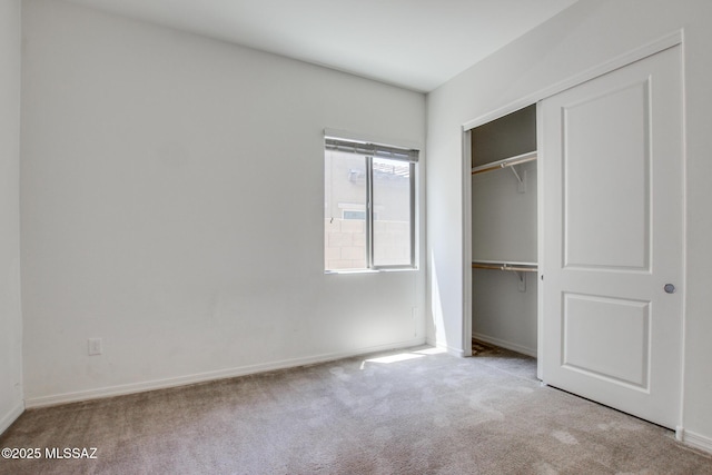 13391 N Flaxleaf Pl, Oro Valley, AZ 85755 - unfurnished bedroom with carpet flooring, baseboards, and a closet