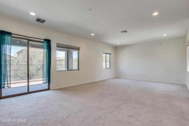 13391 N Flaxleaf Pl, Oro Valley, AZ 85755 - spare room with light colored carpet, recessed lighting, and baseboards