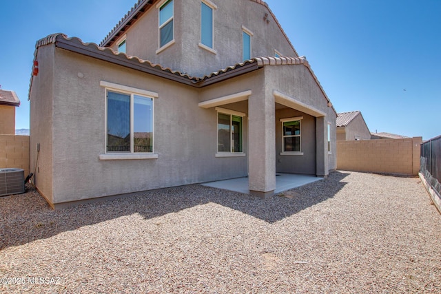 13391 N Flaxleaf Pl, Oro Valley, AZ 85755 - back of house with central AC, a fenced backyard, a patio, stucco siding, and a tile roof