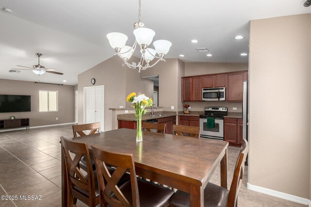 4112 E Shadow Branch Dr, Tucson, AZ 85756 - dining space featuring vaulted ceiling, light tile patterned floors, recessed lighting, baseboards, and a chandelier