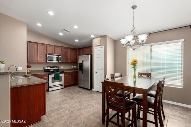 4112 E Shadow Branch Dr, Tucson, AZ 85756 - kitchen featuring appliances with stainless steel finishes, a sink, a chandelier, lofted ceiling, and stone countertops