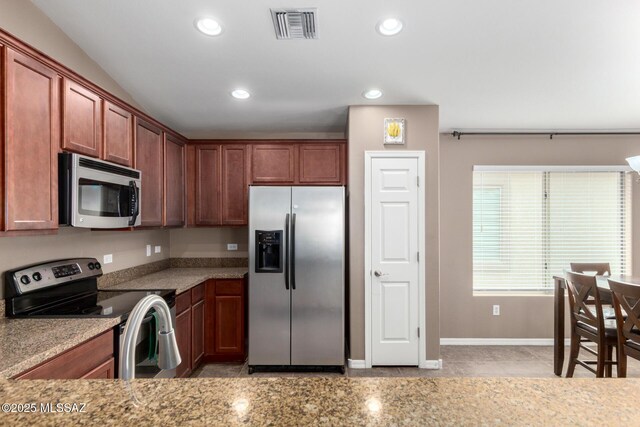 4112 E Shadow Branch Dr, Tucson, AZ 85756 - kitchen with stainless steel appliances, recessed lighting, light tile patterned floors, baseboards, and light stone counters