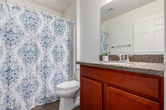 4112 E Shadow Branch Dr, Tucson, AZ 85756 - full bathroom featuring vanity, tile patterned floors, toilet, and curtained shower