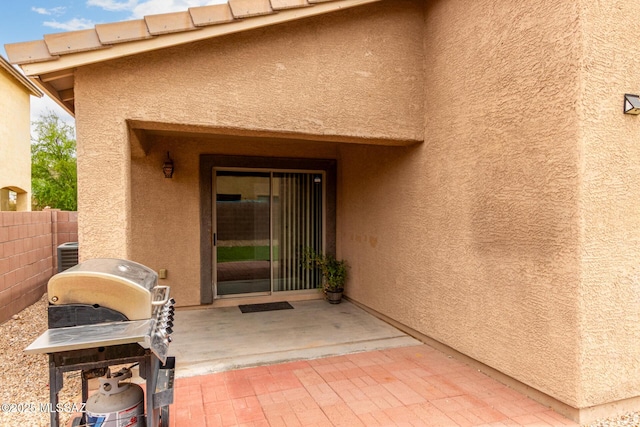 4112 E Shadow Branch Dr, Tucson, AZ 85756 - doorway to property with a patio and stucco siding
