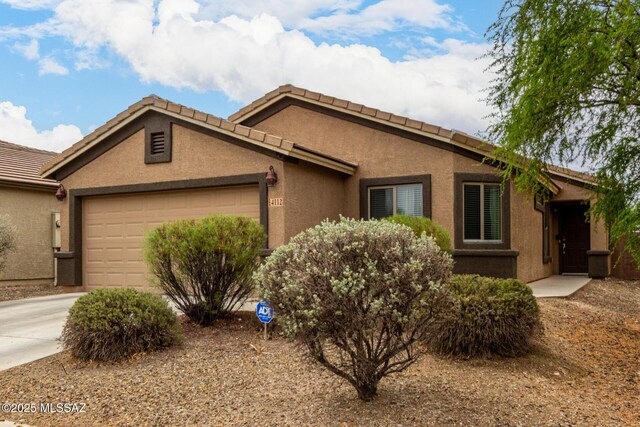 4112 E Shadow Branch Dr, Tucson, AZ 85756 - ranch-style home featuring a garage, stucco siding, a tile roof, and driveway