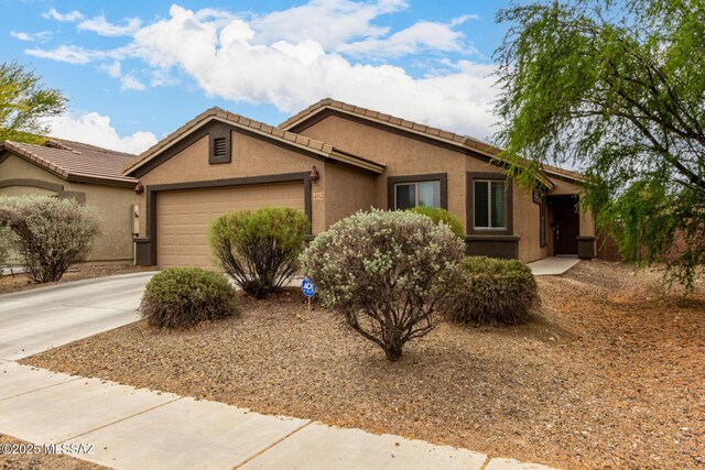 4112 E Shadow Branch Dr, Tucson, AZ 85756 - single story home with an attached garage, driveway, stucco siding, and a tiled roof