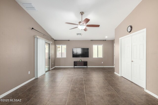 4112 E Shadow Branch Dr, Tucson, AZ 85756 - unfurnished living room featuring a ceiling fan, plenty of natural light, lofted ceiling, baseboards, and dark tile patterned floors