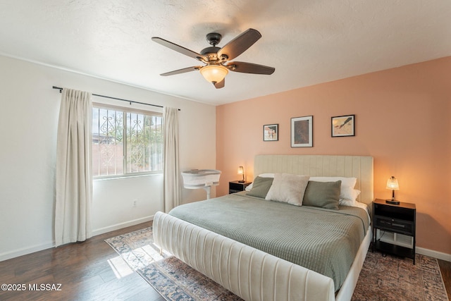 2501 W Calle Paraiso, Tucson, AZ 85745 - bedroom featuring baseboards, wood finished floors, and a ceiling fan