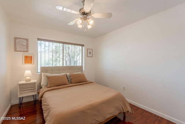 2501 W Calle Paraiso, Tucson, AZ 85745 - bedroom with wood finished floors, baseboards, and a ceiling fan