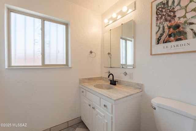 2501 W Calle Paraiso, Tucson, AZ 85745 - bathroom with healthy amount of natural light, vanity, and toilet
