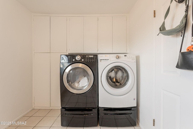2501 W Calle Paraiso, Tucson, AZ 85745 - laundry room with independent washer and dryer, light tile patterned floors, and baseboards