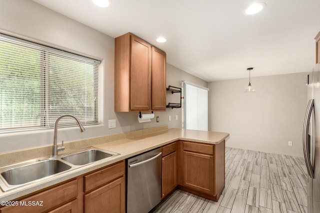 318 N Hasman Dr, Tucson, AZ 85745 - kitchen with appliances with stainless steel finishes, a sink, a peninsula, light countertops, and recessed lighting