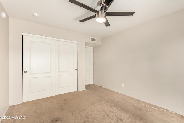 318 N Hasman Dr, Tucson, AZ 85745 - unfurnished bedroom featuring carpet flooring, a closet, a ceiling fan, and baseboards
