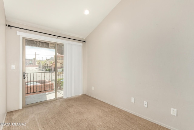 318 N Hasman Dr, Tucson, AZ 85745 - spare room featuring carpet flooring, lofted ceiling, and baseboards
