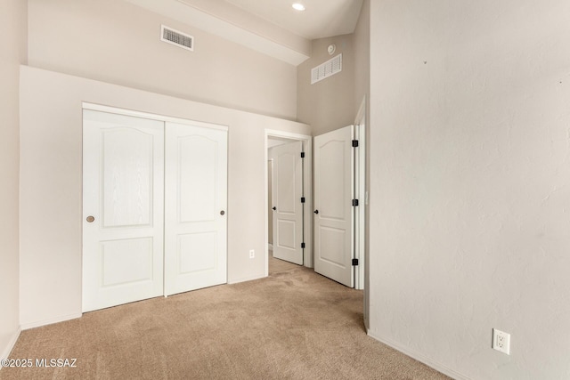 318 N Hasman Dr, Tucson, AZ 85745 - unfurnished bedroom featuring carpet flooring, high vaulted ceiling, a closet, baseboards, and beam ceiling