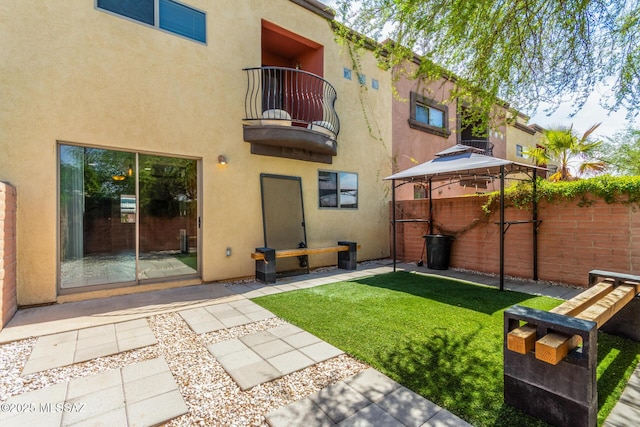 318 N Hasman Dr, Tucson, AZ 85745 - rear view of house featuring a balcony, a gazebo, and stucco siding