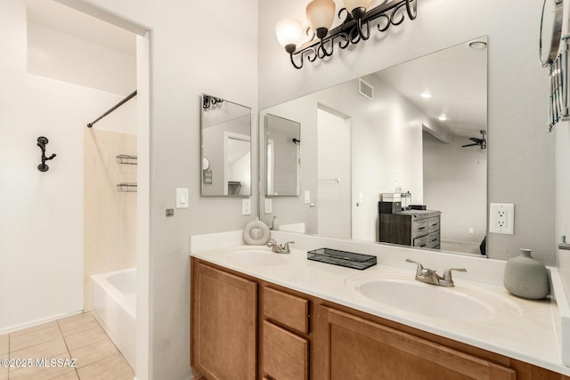 318 N Hasman Dr, Tucson, AZ 85745 - bathroom featuring double vanity, washtub / shower combination, tile patterned flooring, and a ceiling fan