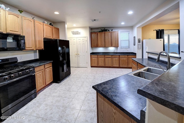 4795 E Silverpuffs Way, Tucson, AZ 85756 - kitchen featuring black appliances, a sink, dark countertops, recessed lighting, and light tile patterned floors