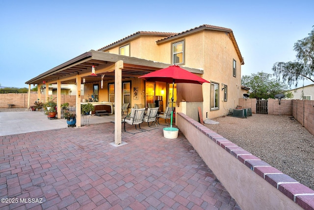 4795 E Silverpuffs Way, Tucson, AZ 85756 - rear view of house featuring a patio, a fenced backyard, a gate, and stucco siding