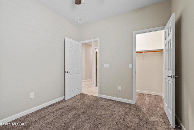 12223 E Becker Dr, Vail, AZ 85641 - unfurnished bedroom with carpet, a spacious closet, baseboards, a closet, and a ceiling fan