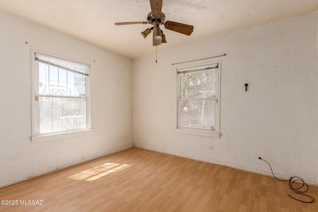 1026 E Mitchell St, Tucson, AZ 85719 - unfurnished room featuring wood finished floors and a ceiling fan