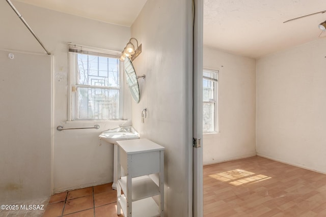 1026 E Mitchell St, Tucson, AZ 85719 - bathroom with wood finished floors