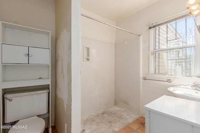 1026 E Mitchell St, Tucson, AZ 85719 - full bathroom featuring a stall shower, toilet, vanity, and tile patterned floors