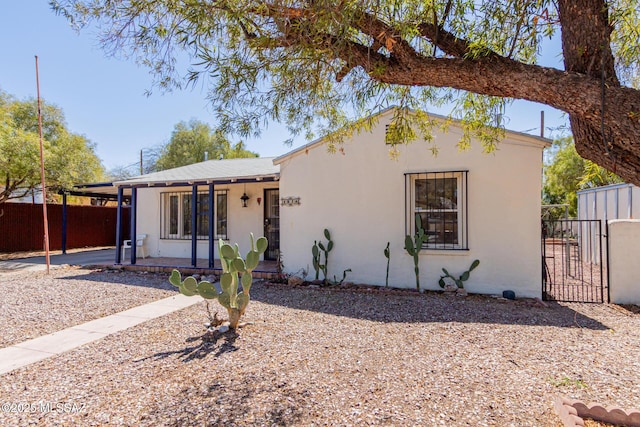 1026 E Mitchell St, Tucson, AZ 85719 - view of front of property featuring a gate and stucco siding