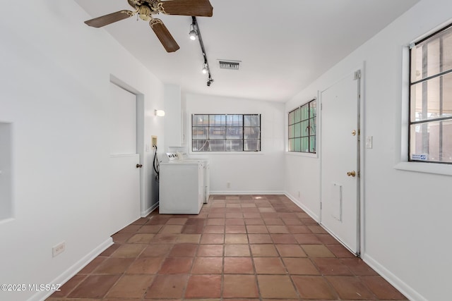 1026 E Mitchell St, Tucson, AZ 85719 - laundry area featuring washing machine and dryer, plenty of natural light, a ceiling fan, and track lighting