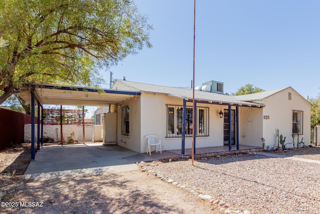 1026 E Mitchell St, Tucson, AZ 85719 - view of front of home featuring an attached carport and stucco siding