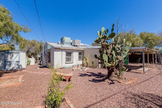 1026 E Mitchell St, Tucson, AZ 85719 - back of property featuring stucco siding and central air condition unit