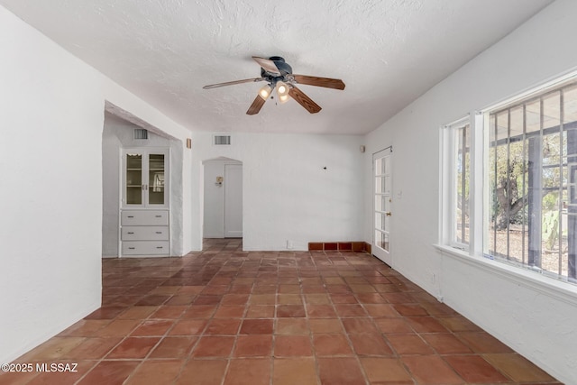1026 E Mitchell St, Tucson, AZ 85719 - unfurnished room featuring ceiling fan and a textured ceiling