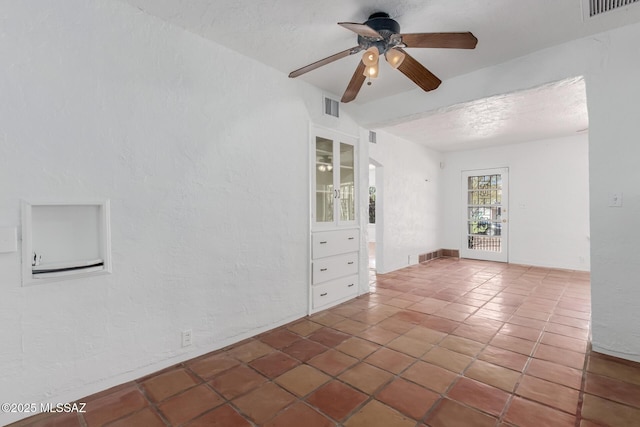 1026 E Mitchell St, Tucson, AZ 85719 - tiled empty room featuring a ceiling fan and a textured wall