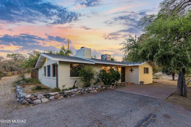 365 E Parkside St, Oracle, AZ 85623 - ranch-style home featuring a chimney, concrete block siding, and roof with shingles