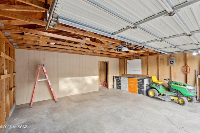 365 E Parkside St, Oracle, AZ 85623 - garage with a garage door opener and wood walls