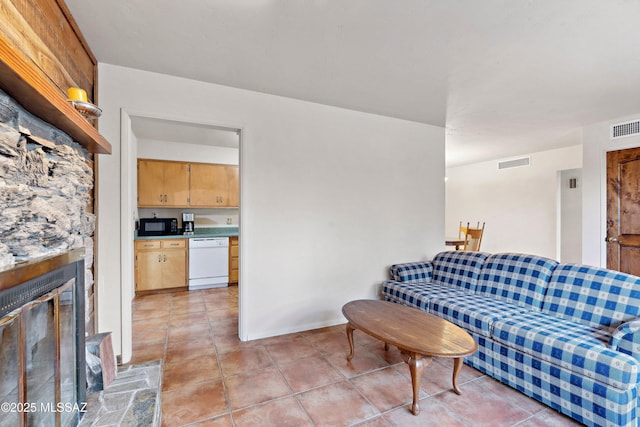 365 E Parkside St, Oracle, AZ 85623 - living room with light tile patterned flooring and a fireplace