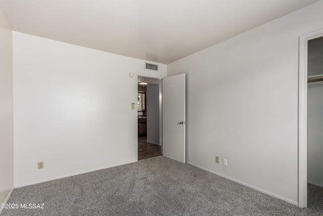 1238 S Camino Seco, Tucson, AZ 85710 - unfurnished bedroom featuring carpet flooring, baseboards, and a closet