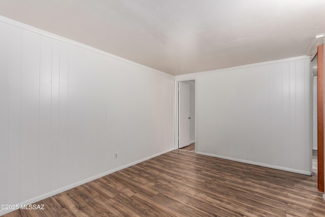 1238 S Camino Seco, Tucson, AZ 85710 - empty room featuring dark wood-type flooring and baseboards