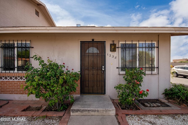 1238 S Camino Seco, Tucson, AZ 85710 - property entrance with stucco siding